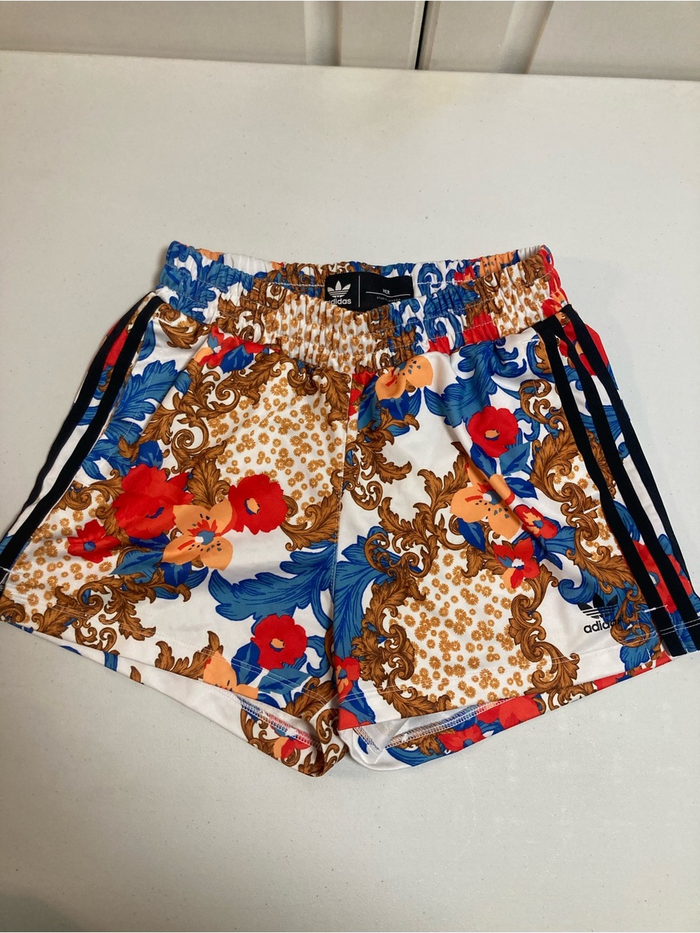 adidas Women's White Floral Athletic Shorts with Blue, Red & Gold Print